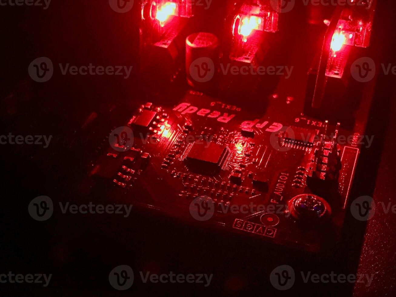 Closeup computer mainboard chipset with red light color photo