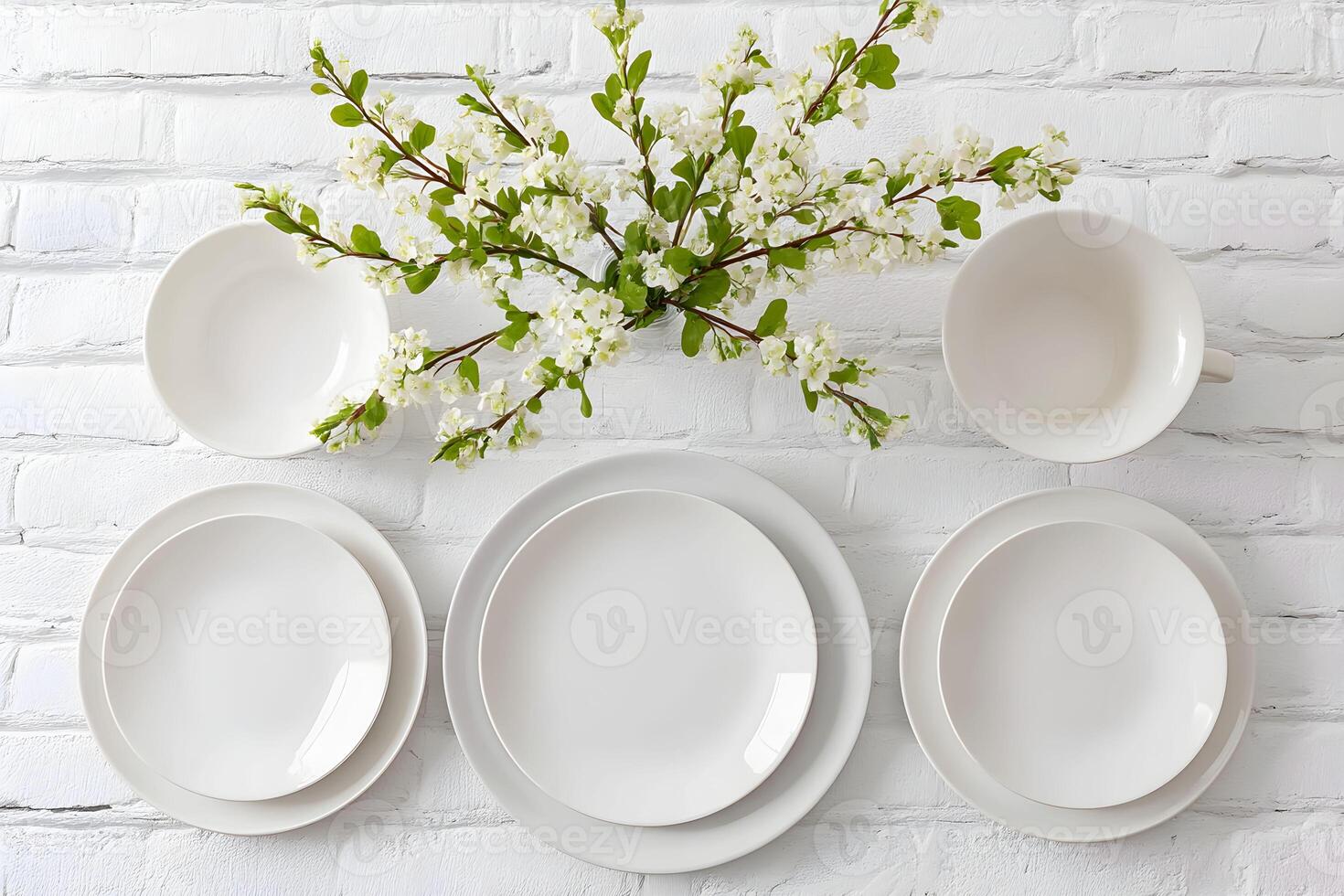 Decorative table setting with white plates and floral arrangement on a rustic background at a cozy dining space in spring photo