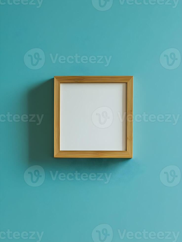 Modern blank frame for wall art mockup showcasing a stylish empty space on a vibrant turquoise wall, perfect for interior design inspiration and creative projects photo