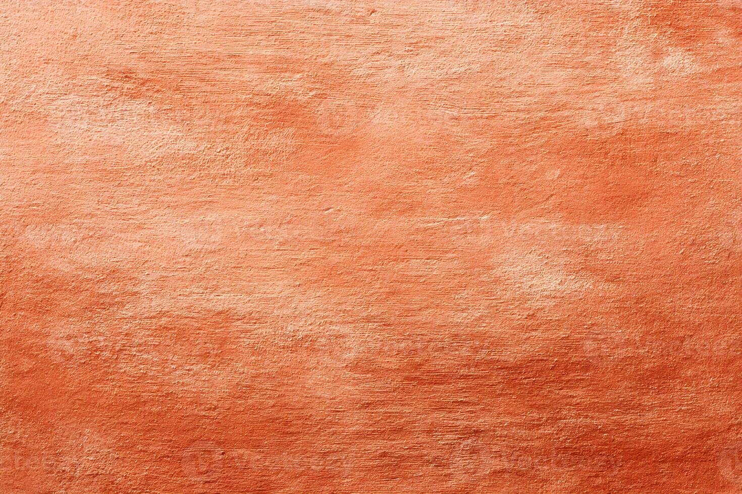 Textured terracotta wall with warm hues showcasing natural patterns and earthy tones under soft lighting during daylight photo