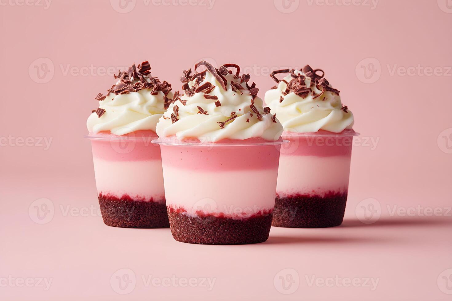 Delicious layered dessert cups with whipped cream and chocolate shavings, perfect for any celebration or sweet craving photo