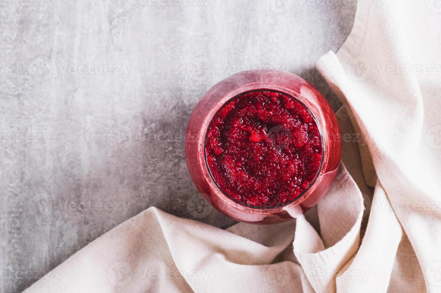 Close up of ABC juice from beetroot, carrot and apple for detox in a glass on the table top view photo