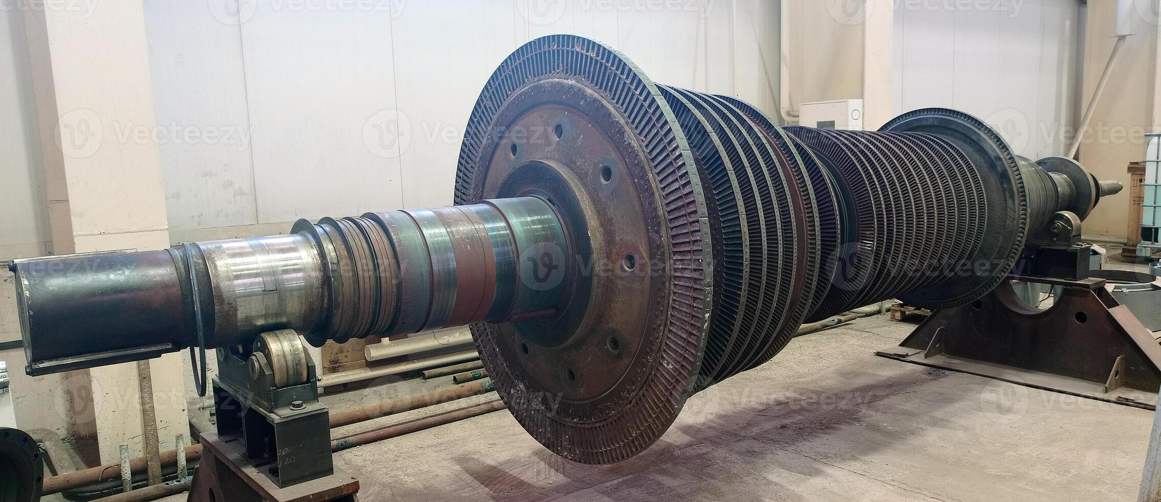 Industrial medium pressure turbine rotor in a workshop. Mechanical engineering. Power engineering. photo