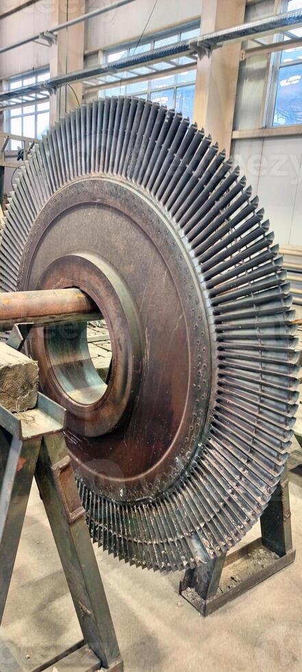 Industrial medium pressure turbine rotor stage in a workshop. Mechanical engineering. Power engineering. photo