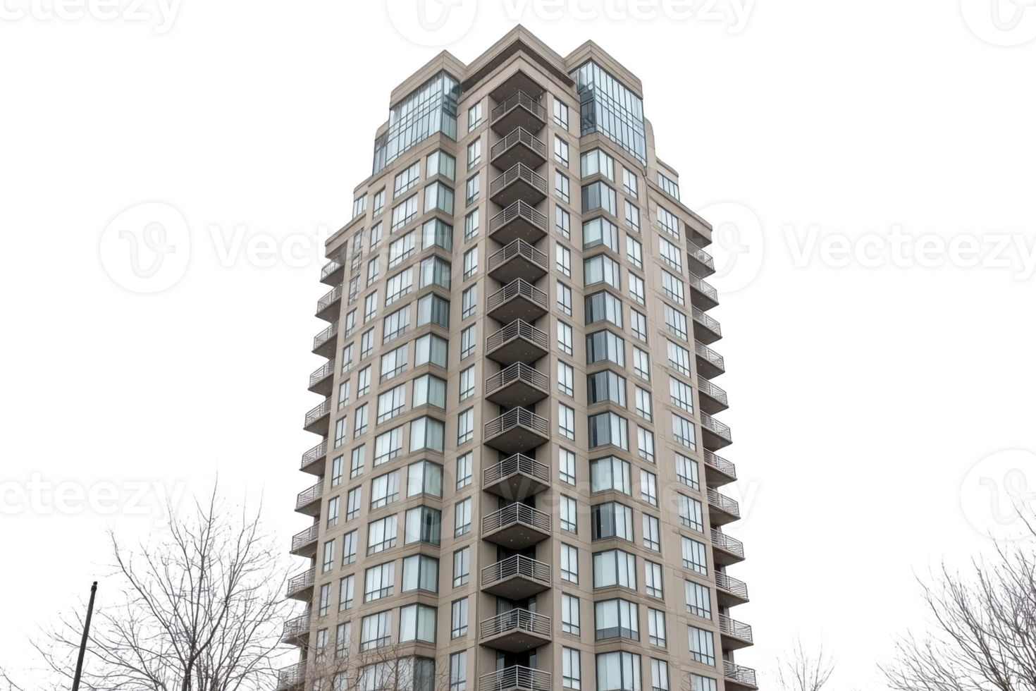 A modern high rise apartment building with numerous balconies and large windows stands tall against clear sky, surrounded by frosty trees png
