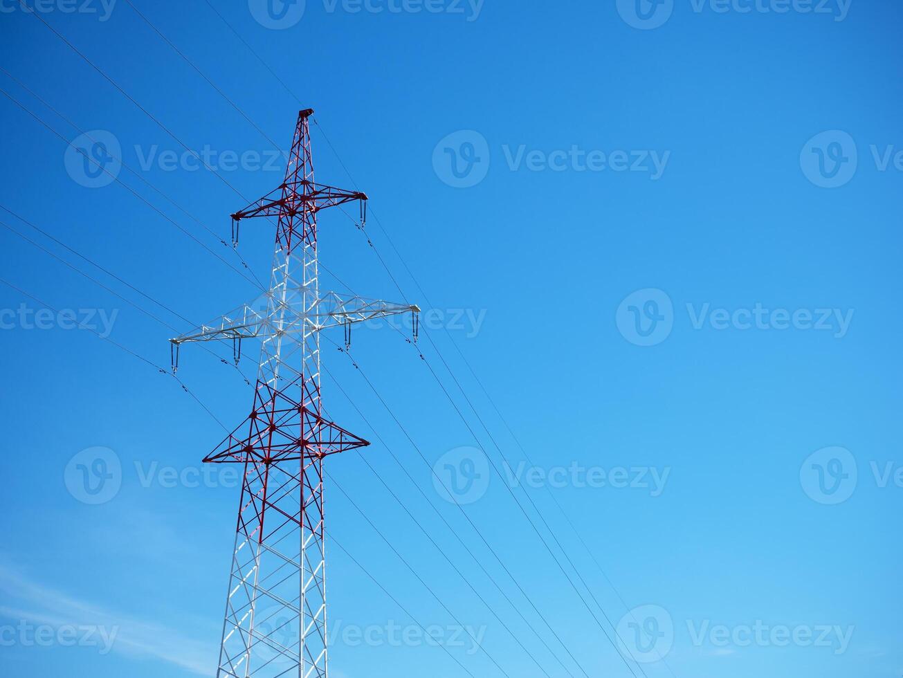 Power lines and poles against the sky. photo