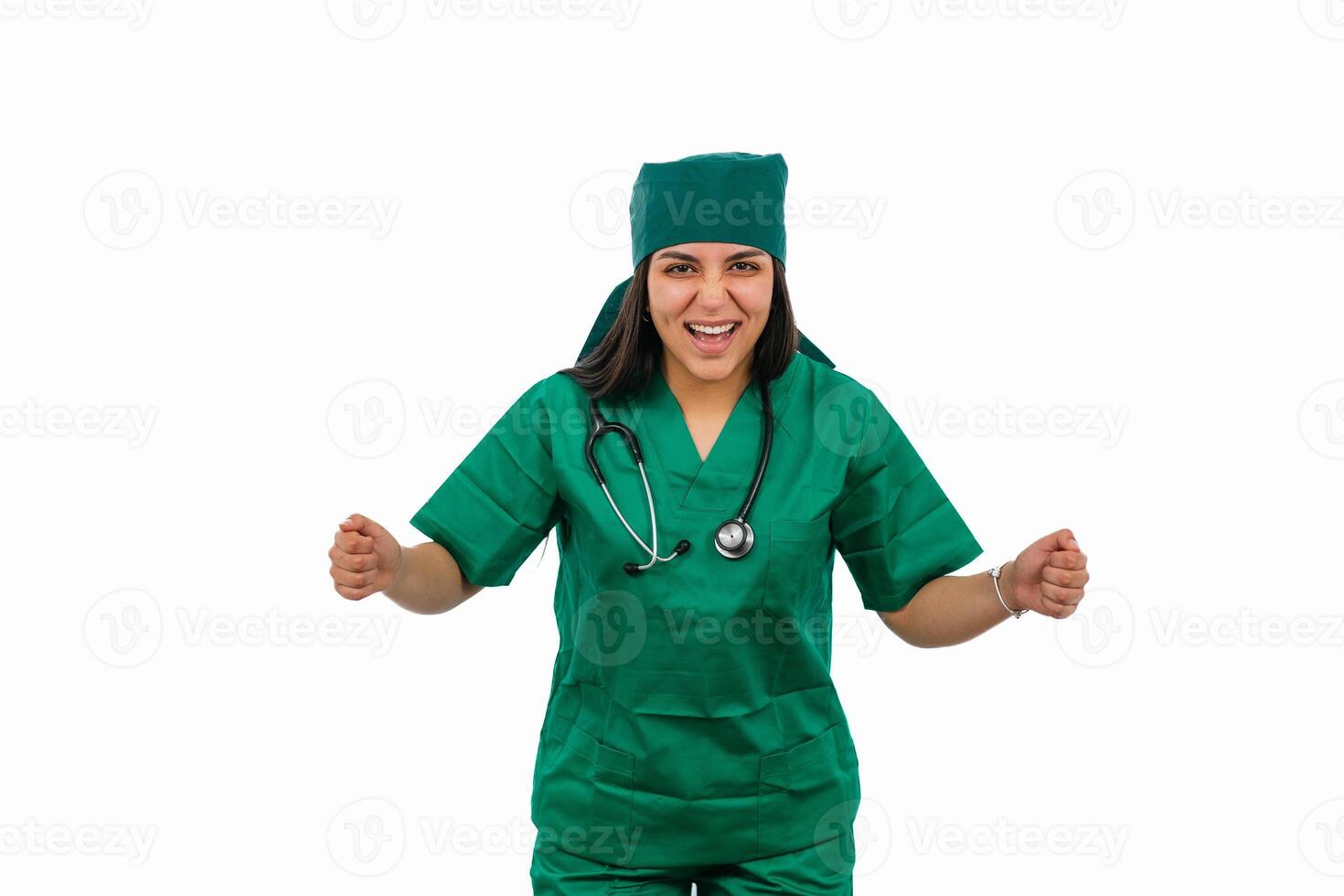 Excited latin surgeon celebrating success on white background photo