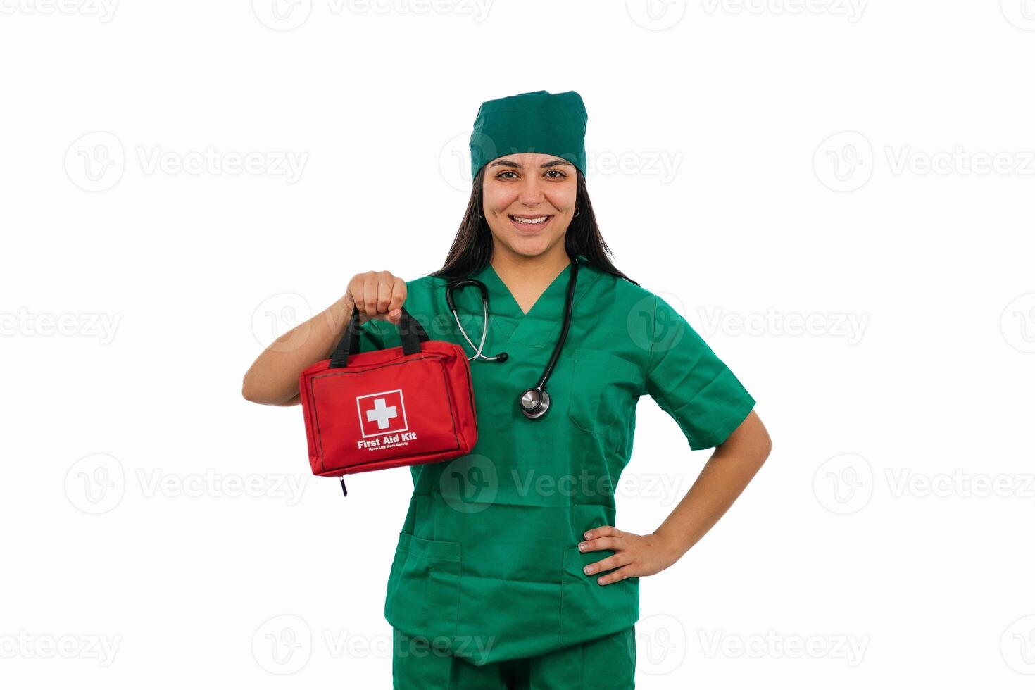 Latin female surgeon holding first aid kit and smiling photo