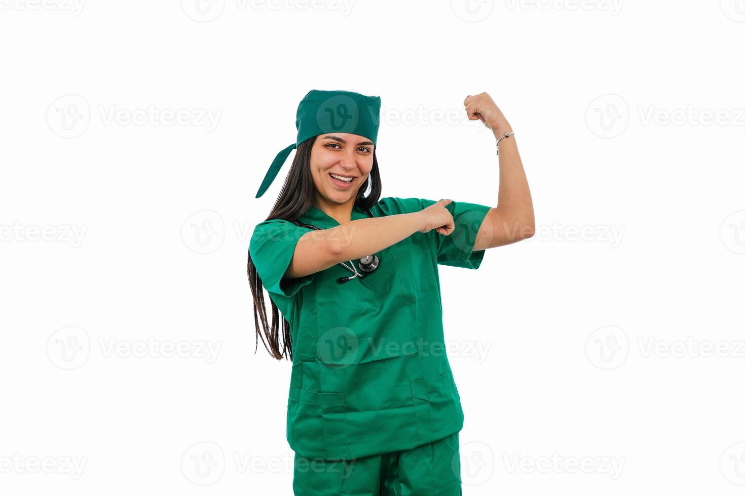 Latin female surgeon showing her biceps and smiling on white background photo