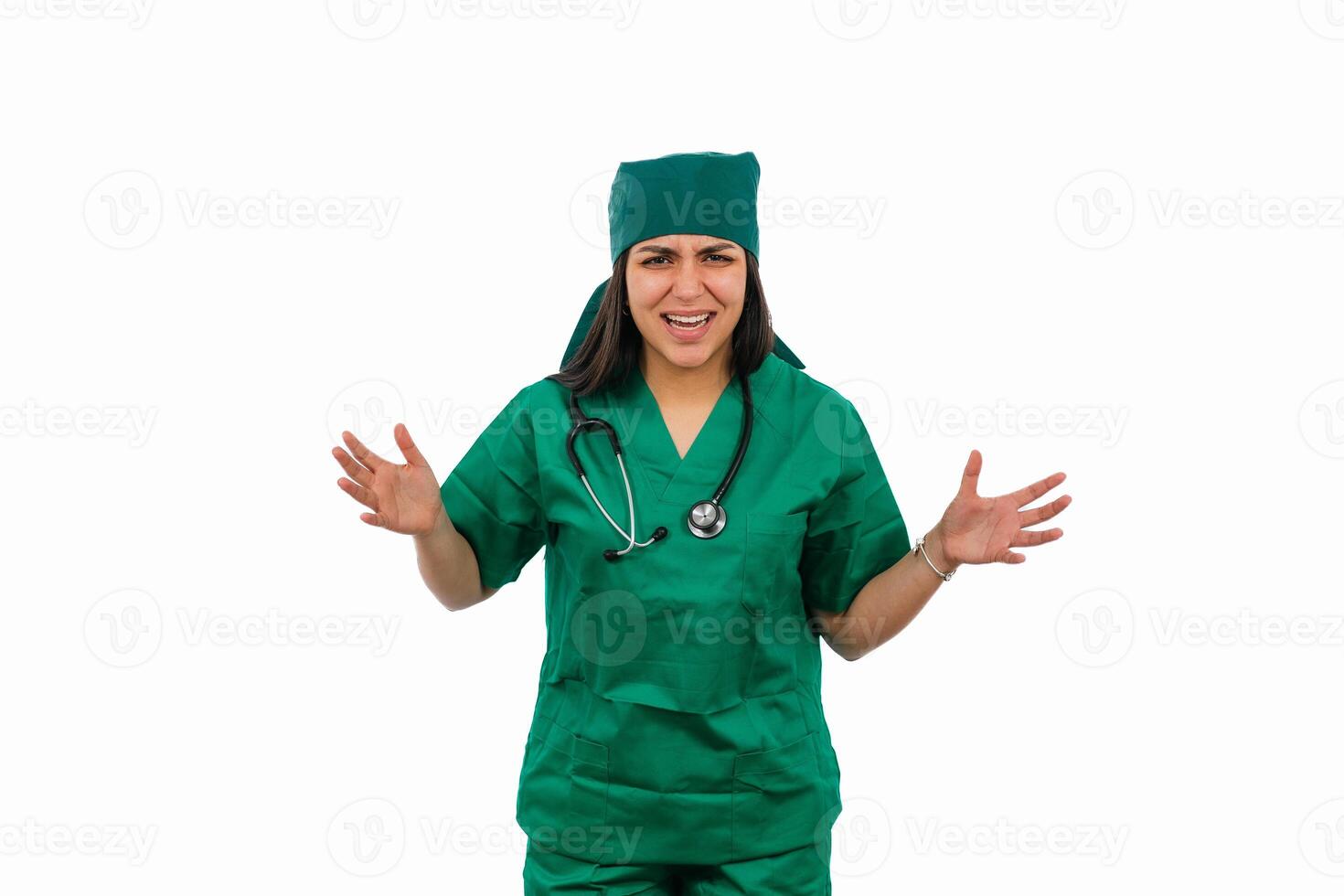 Latin female surgeon wearing green scrubs and stethoscope showing frustration on white background photo