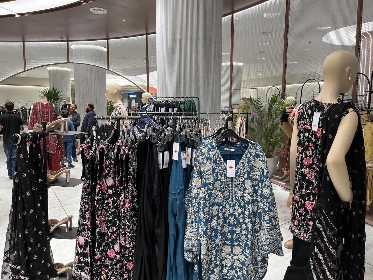 a woman is looking at clothes in a store in Lahore, Pakistan on January 4, 2025. photo