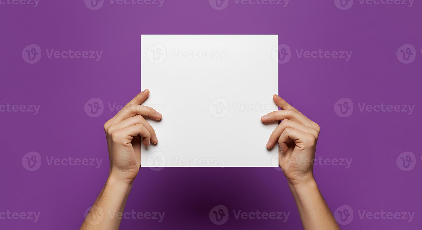 Holding Blank Paper Sheet on Purple Background photo