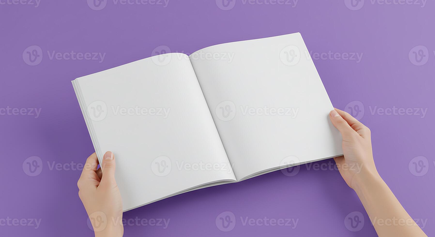 Person Holding Open Book with Blank Pages on Purple Background photo