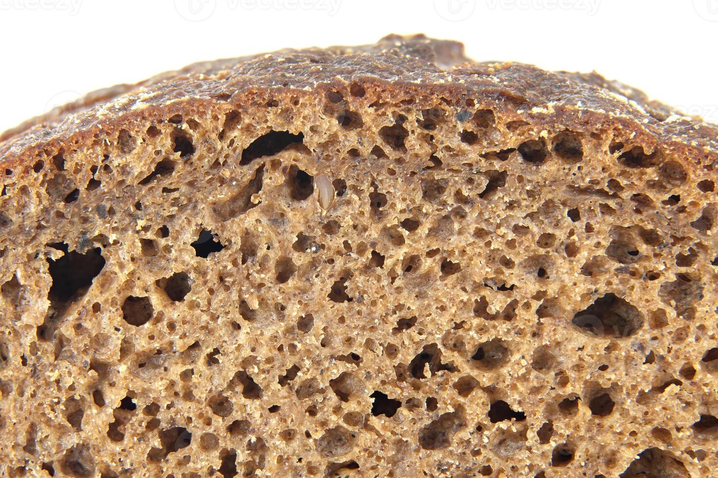 Close-Up of Brown Bread Texture Displaying Porous and Natural Composition photo