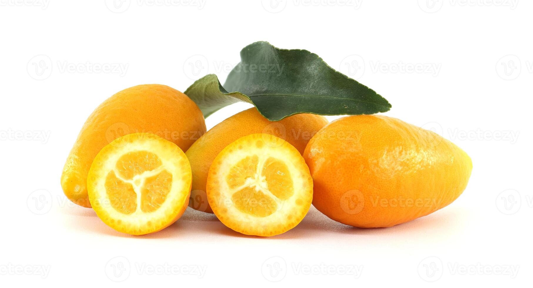 Fresh Kumquats with Sliced Halves and Green Leaf on White Background photo