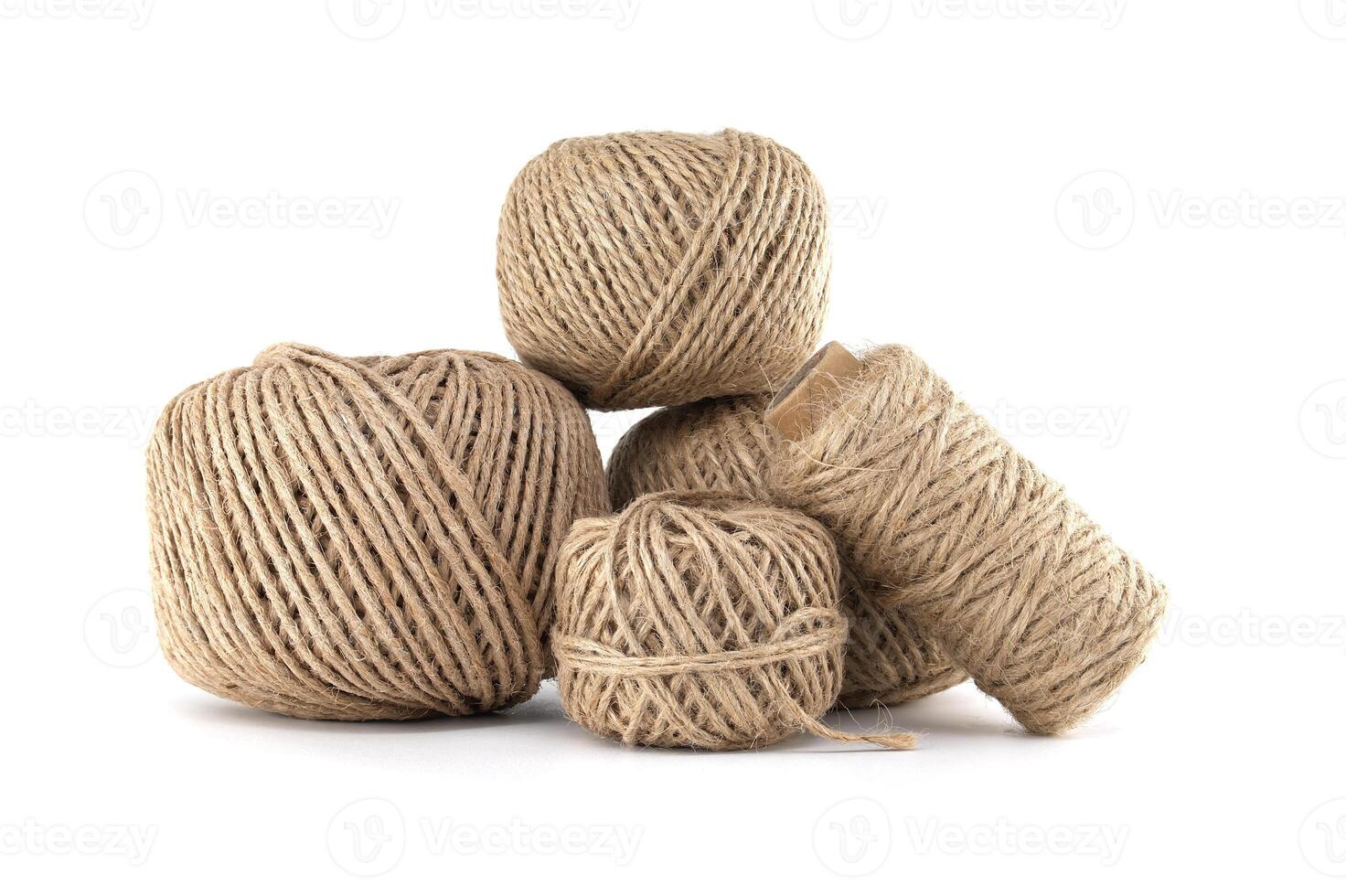 Natural Twine Balls of Various Sizes Isolated on White Background photo