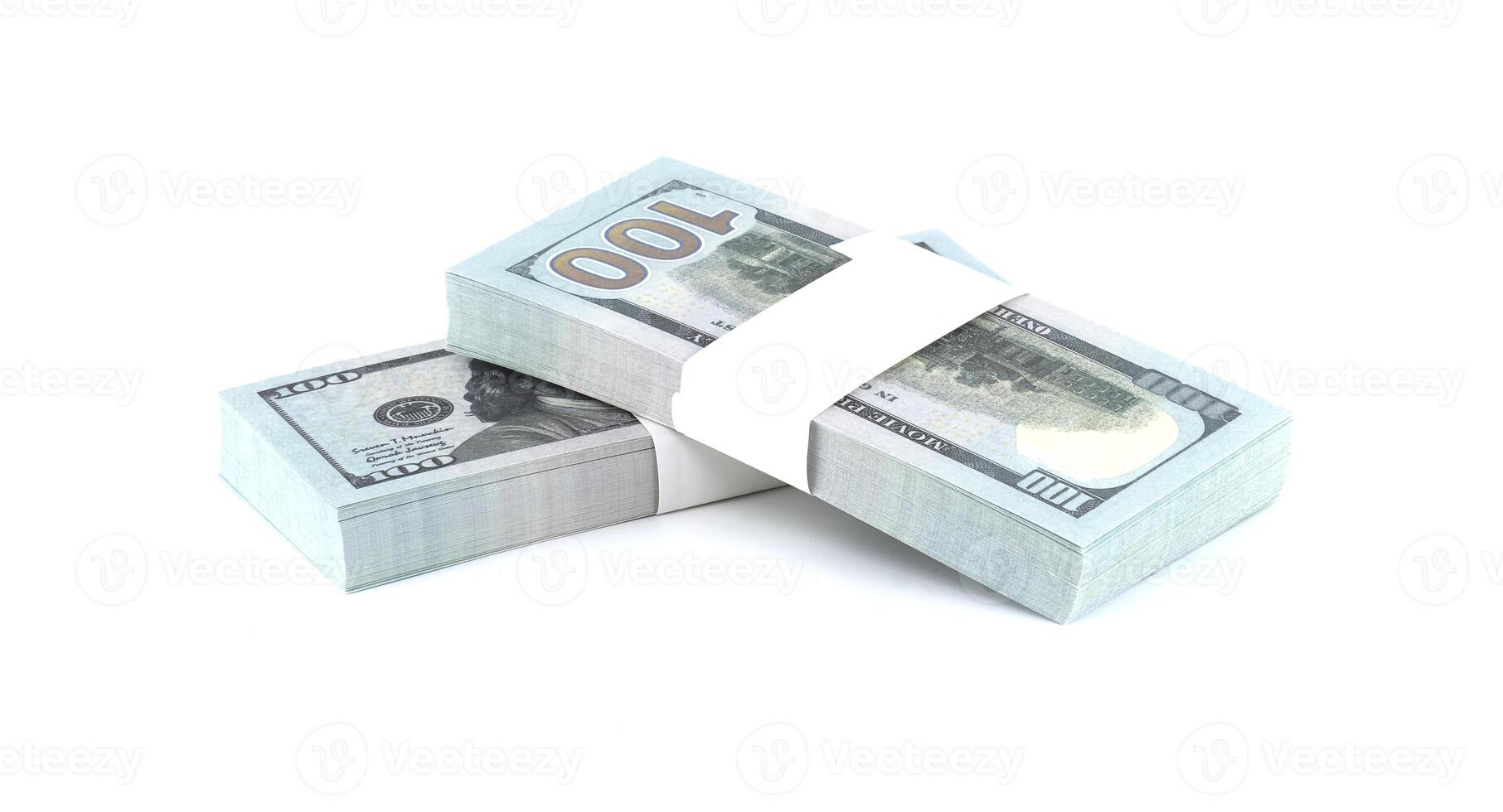 Two bundles of one hundred dollar bills arranged and isolated against a bright white backdrop. photo