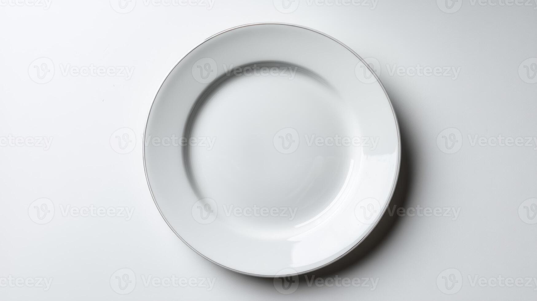 Clean White Dinner Plate with Silver Rim on a White Surface photo