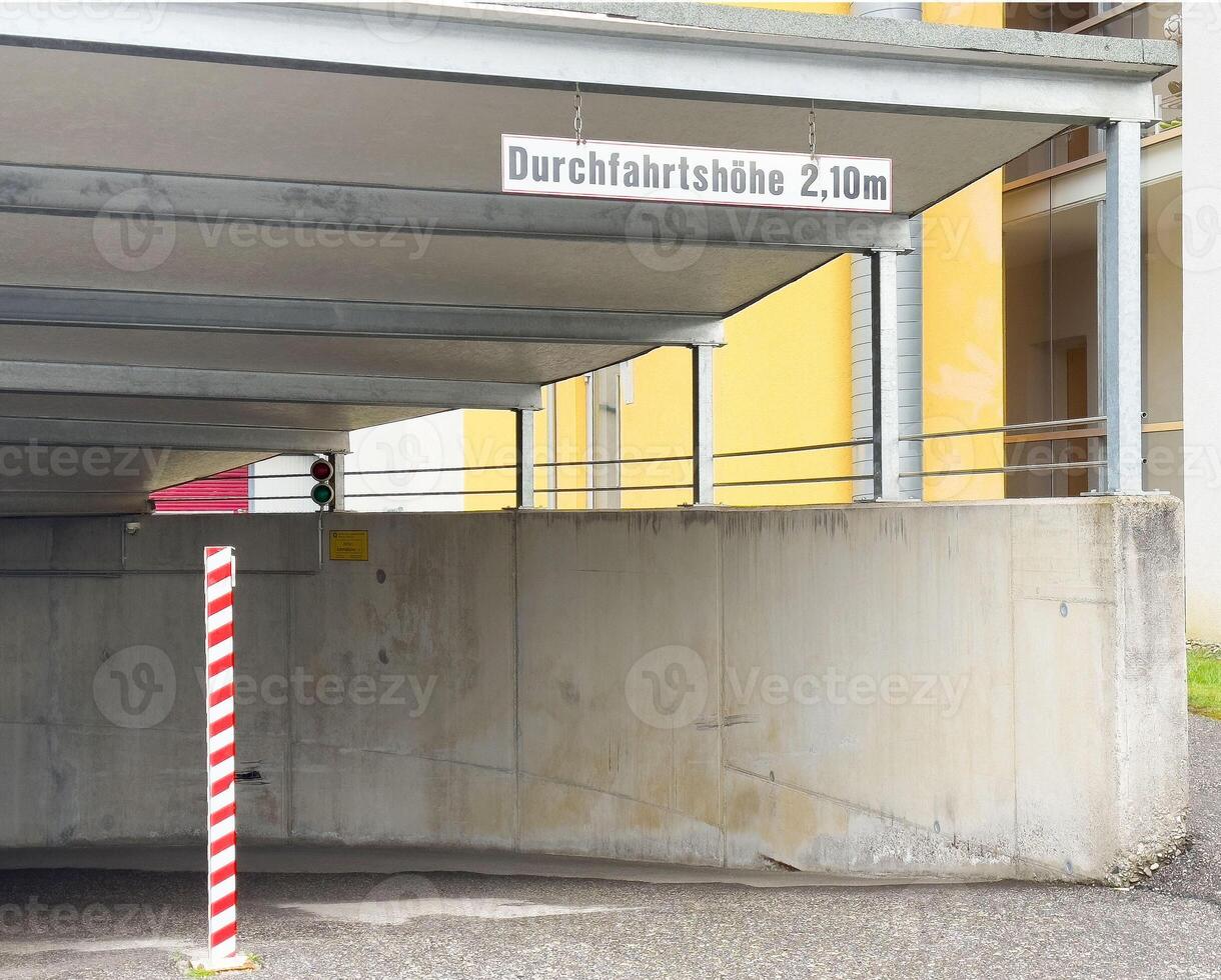 Parking garage height limit signage in german overhead entrance photo
