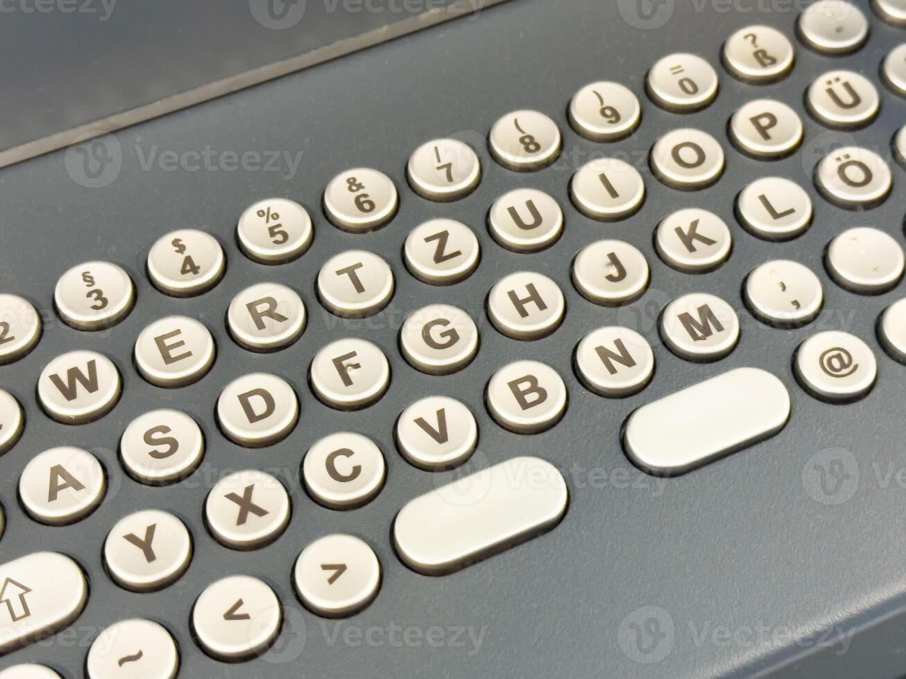Retro german keyboard layout with circular keys and symbols photo