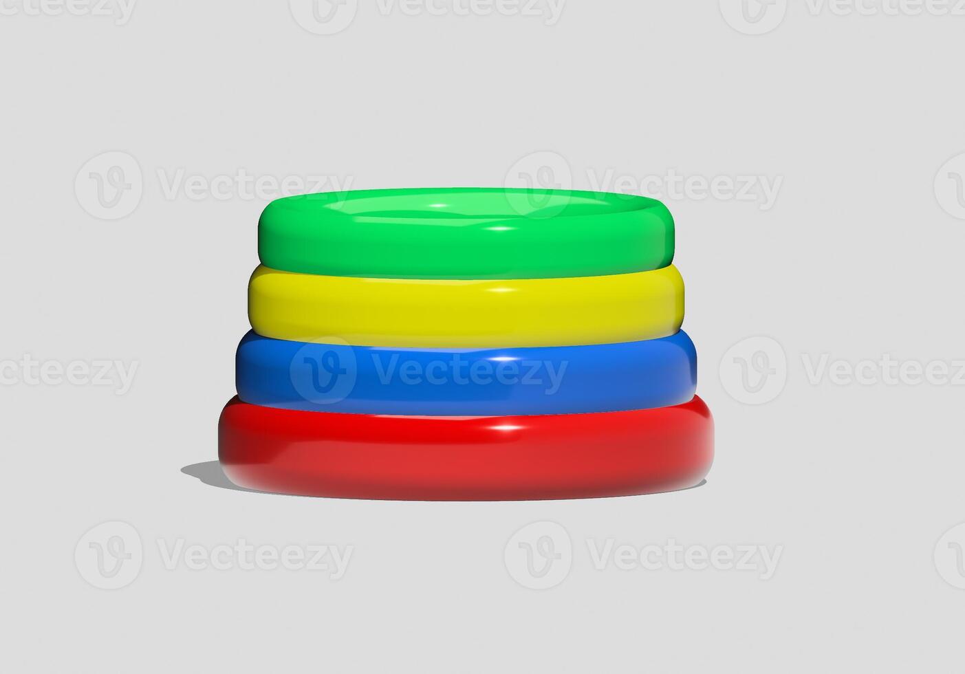 A stack of colorful plastic rings on a gray background photo