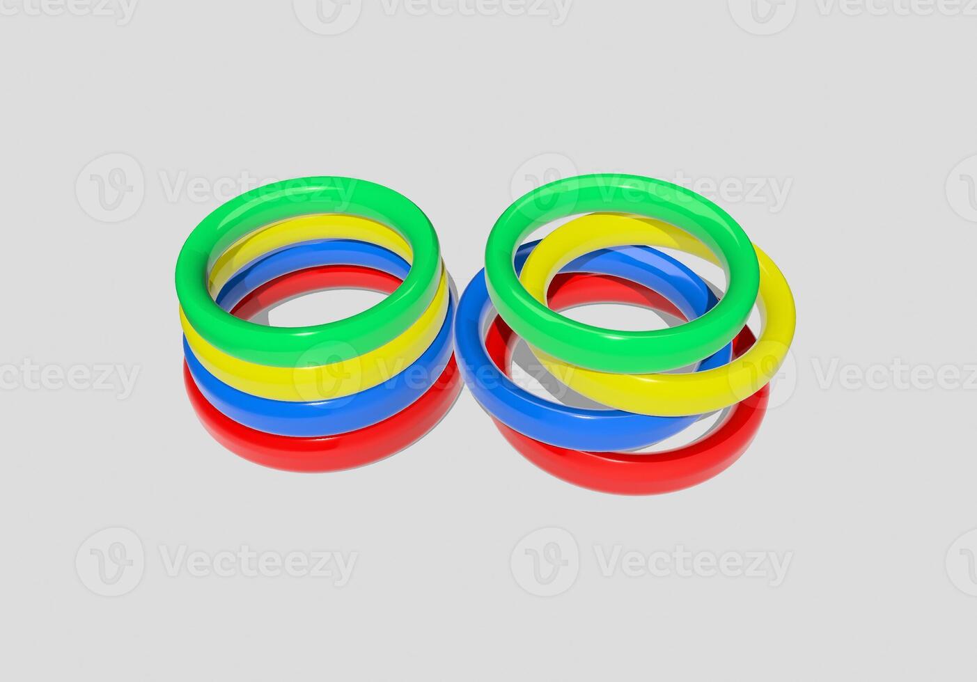 A set of colorful rings on a white surface photo