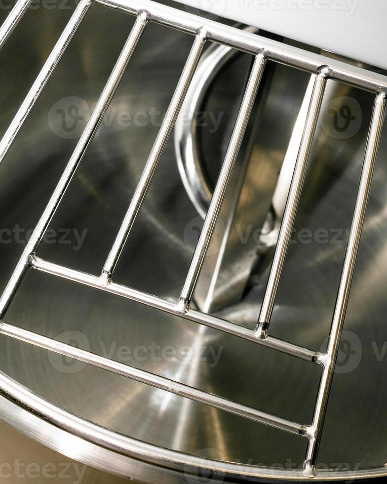Shiny stainless steel oven rack with modern design, perfect for kitchen renovations and Thanksgiving baking preparations photo