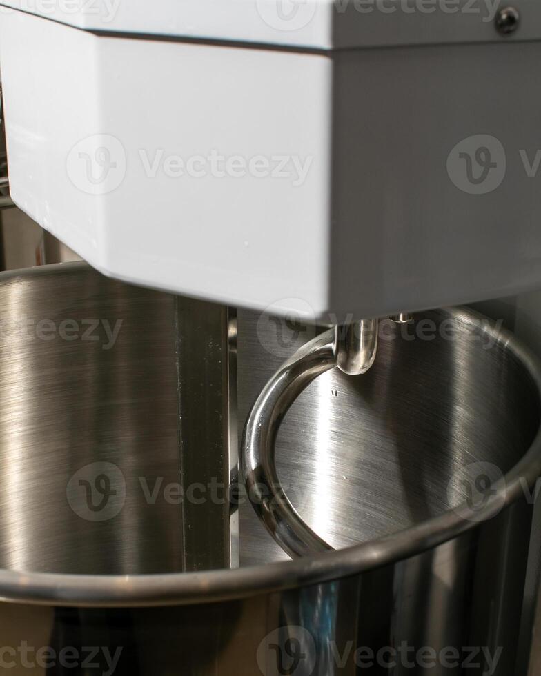 Electric mixer machine ready for baking, perfect for kitchen preparations and festive holiday cooking, modern culinary equipment photo