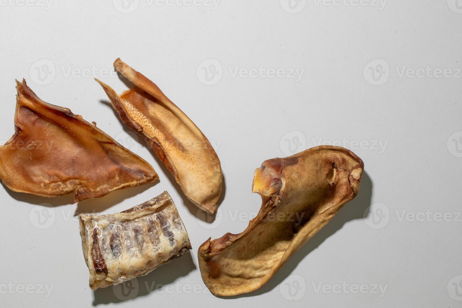 Dog chews on white background, healthy pet treats, natural dried snacks for canine dental care, pet care essentials photo