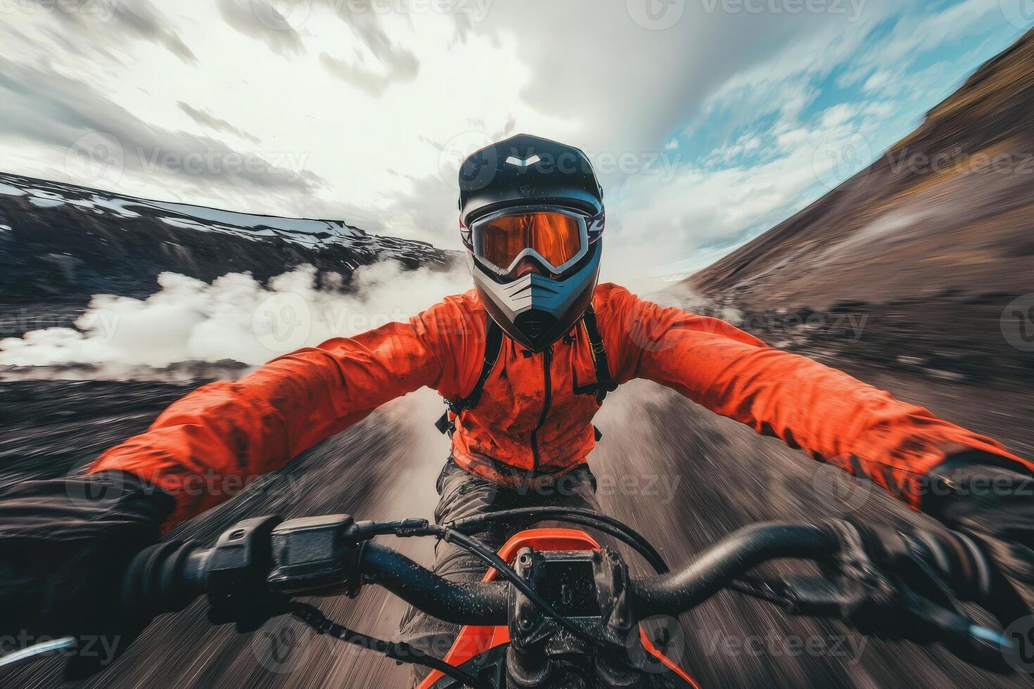 A rider wearing protective gear zooms across a volcanic landscape. Billowing steam and rugged rock formations create a dramatic backdrop against a moody sky. photo