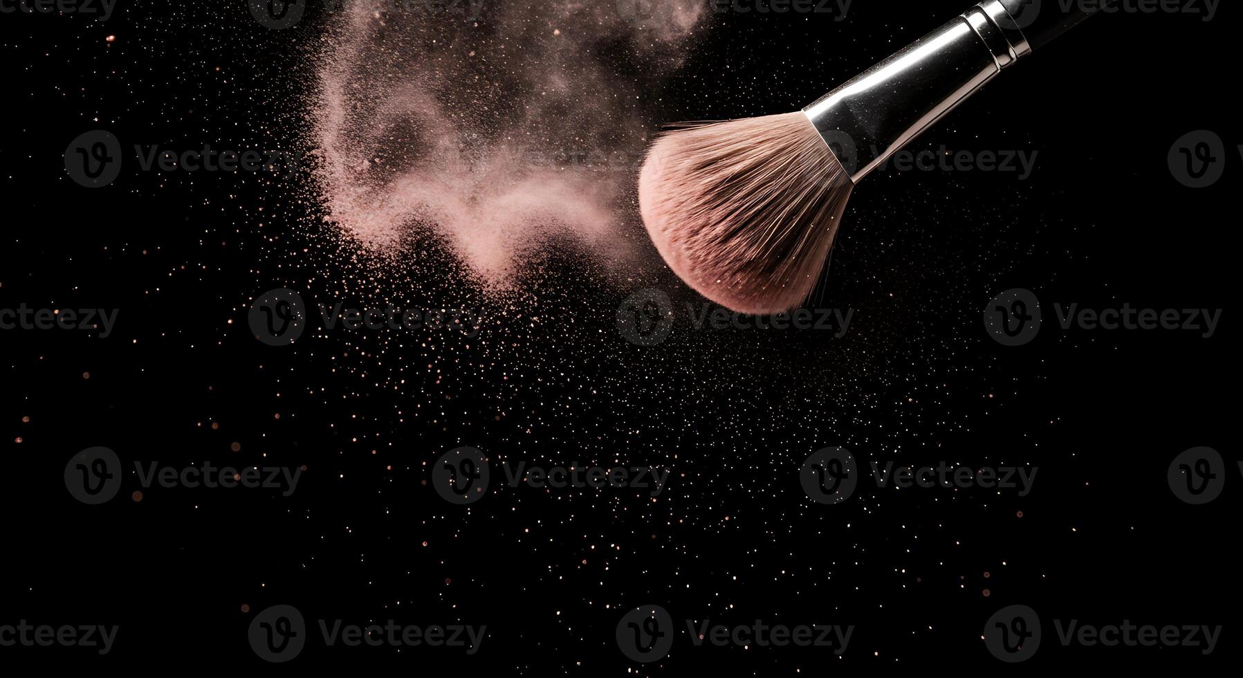 Makeup Brush Releasing Pink Powder on a Black Background for Beauty Concepts photo