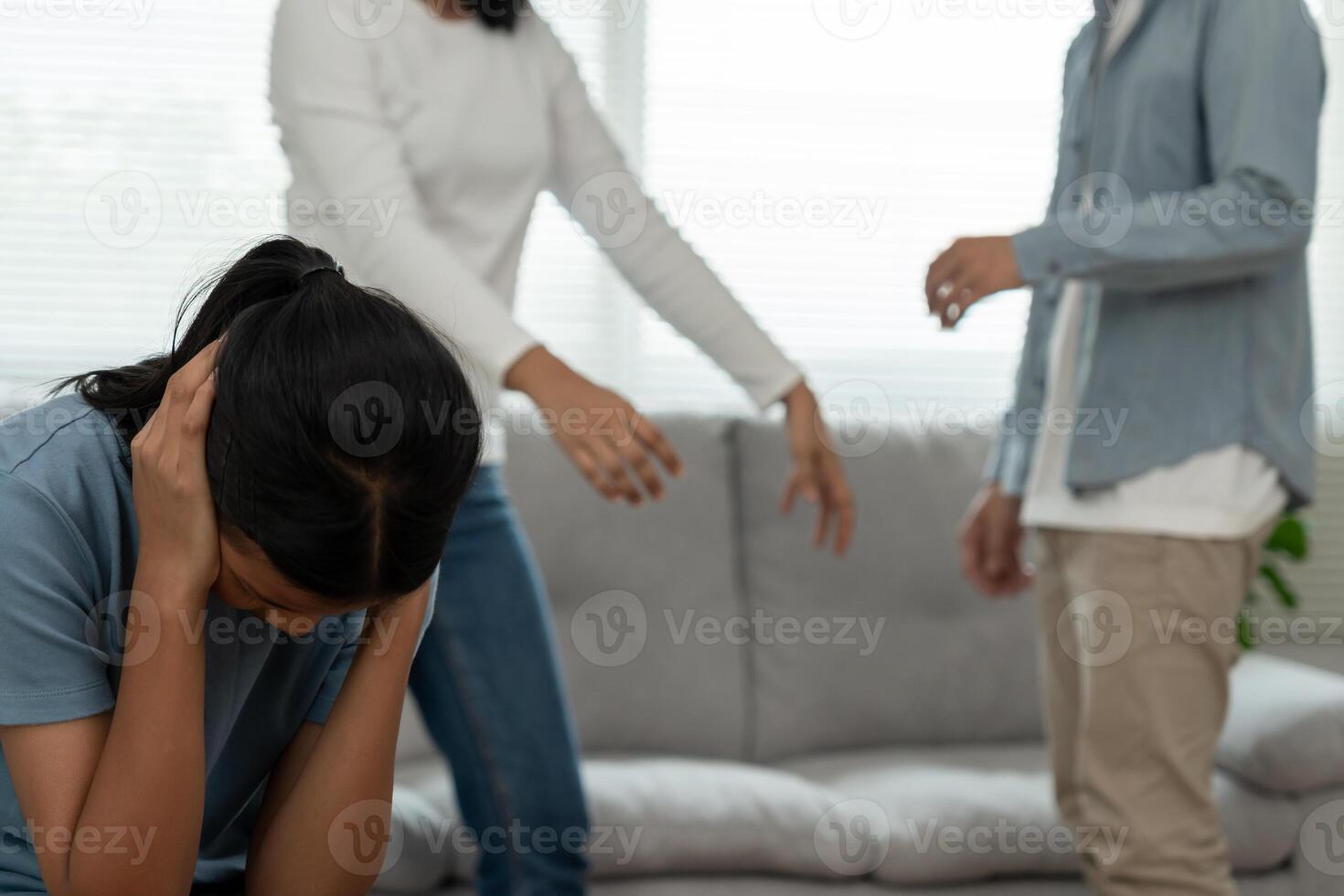 daughter use hands cover your face and feel stressed from the parents quarrel. child is have mental problem. quarrels, violence, depression, suicide, discouragement, social problem photo