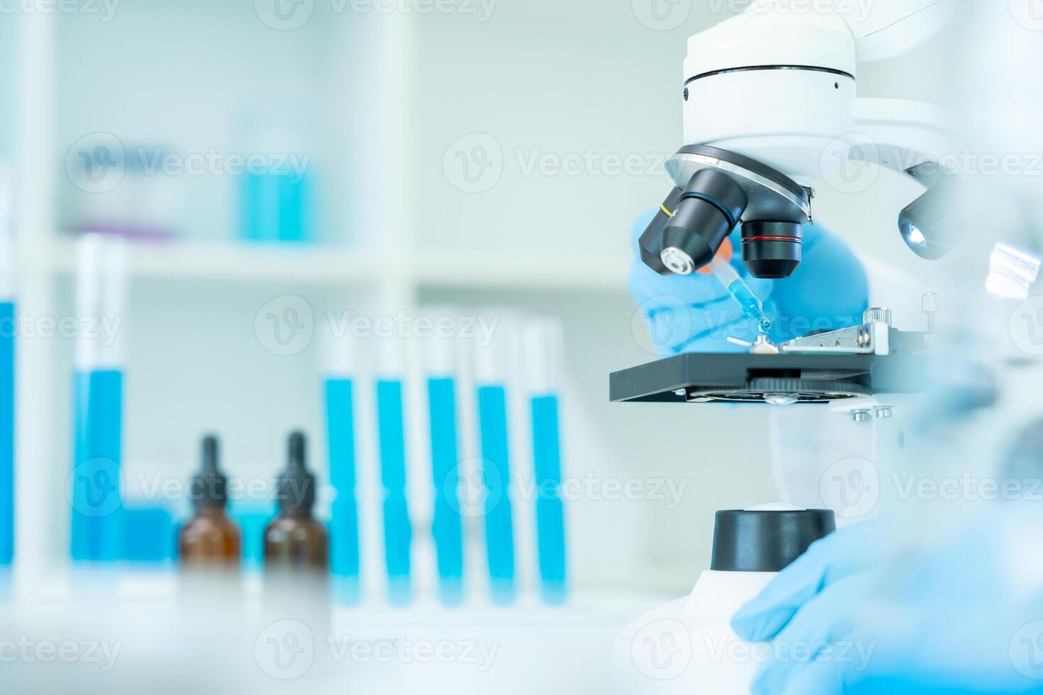 Scientist analyze biochemical samples in advanced scientific laboratory. Medical professional use dropper mix microbiological developmental of viral. Biotechnology research in science lab cosmetic. photo