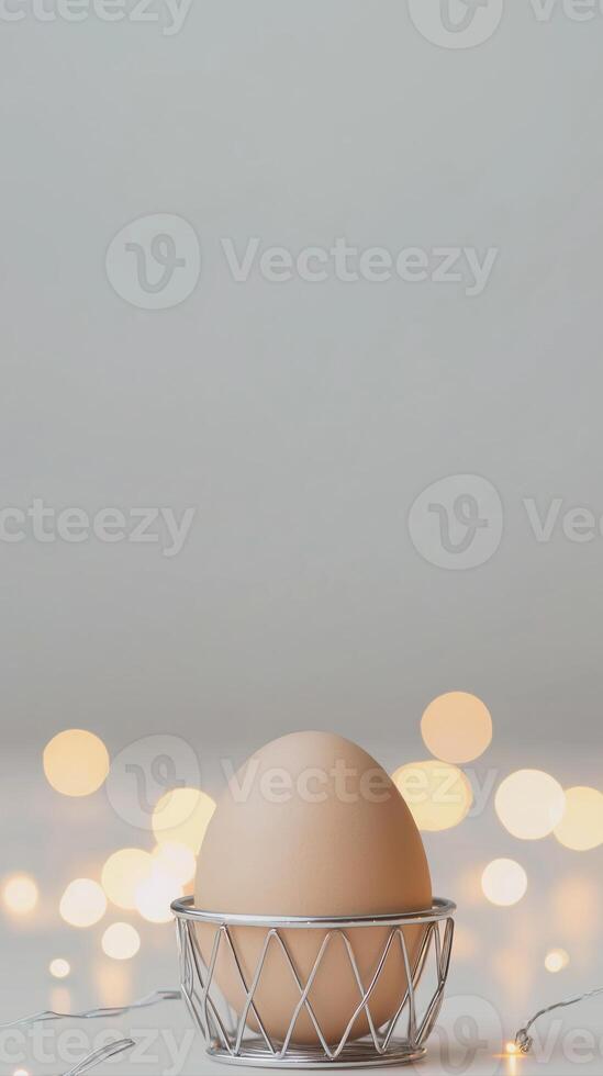 Elegant Egg in Chrome Holder Surrounded by Soft Glowing Lights in a Minimalistic Setting photo