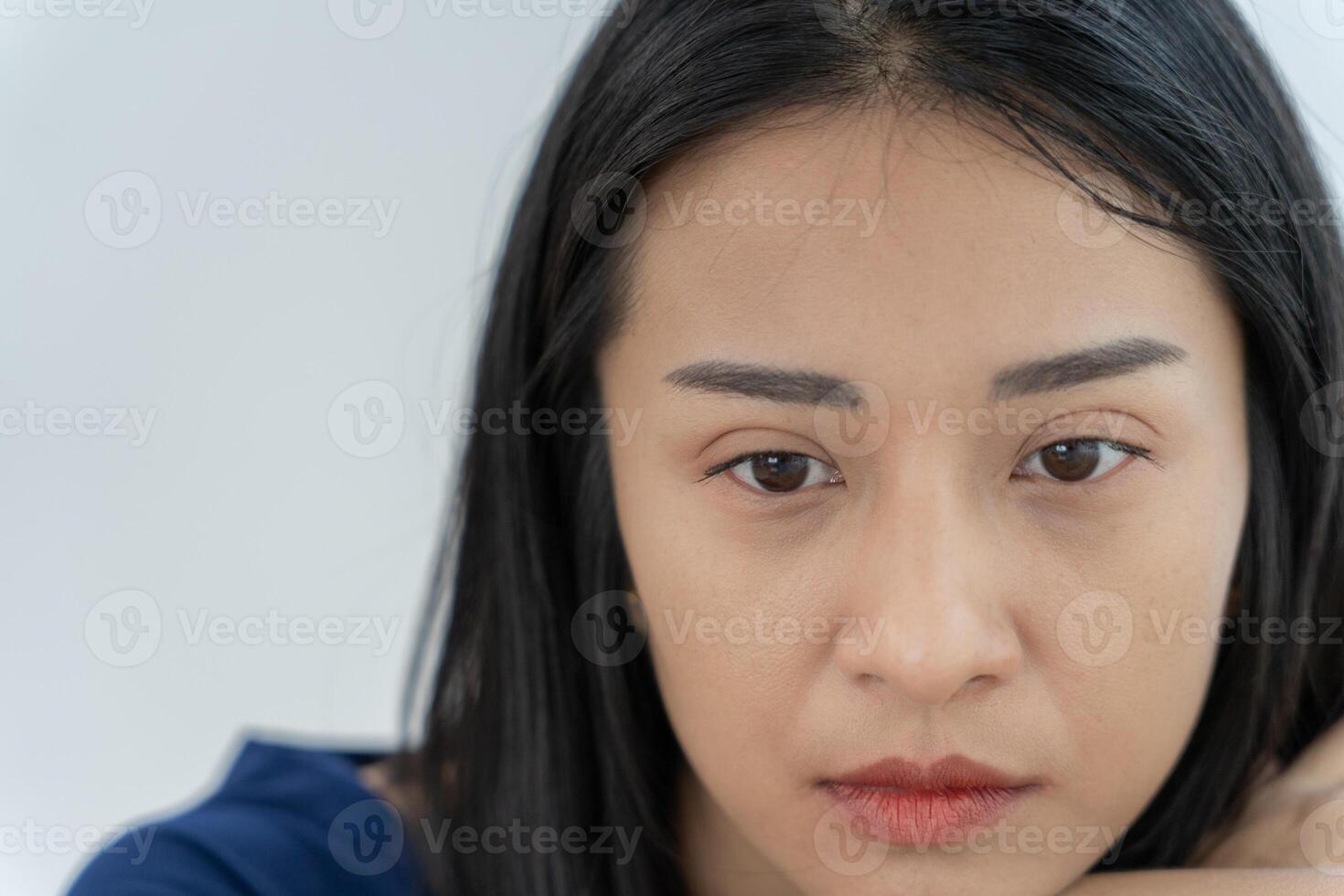 mental illness. Asian woman disappointed, sad after receiving bad news. Stressed girl confused with unhappy problems, arguing with boyfriend, cry and worry about unexpected pregnancy. photo