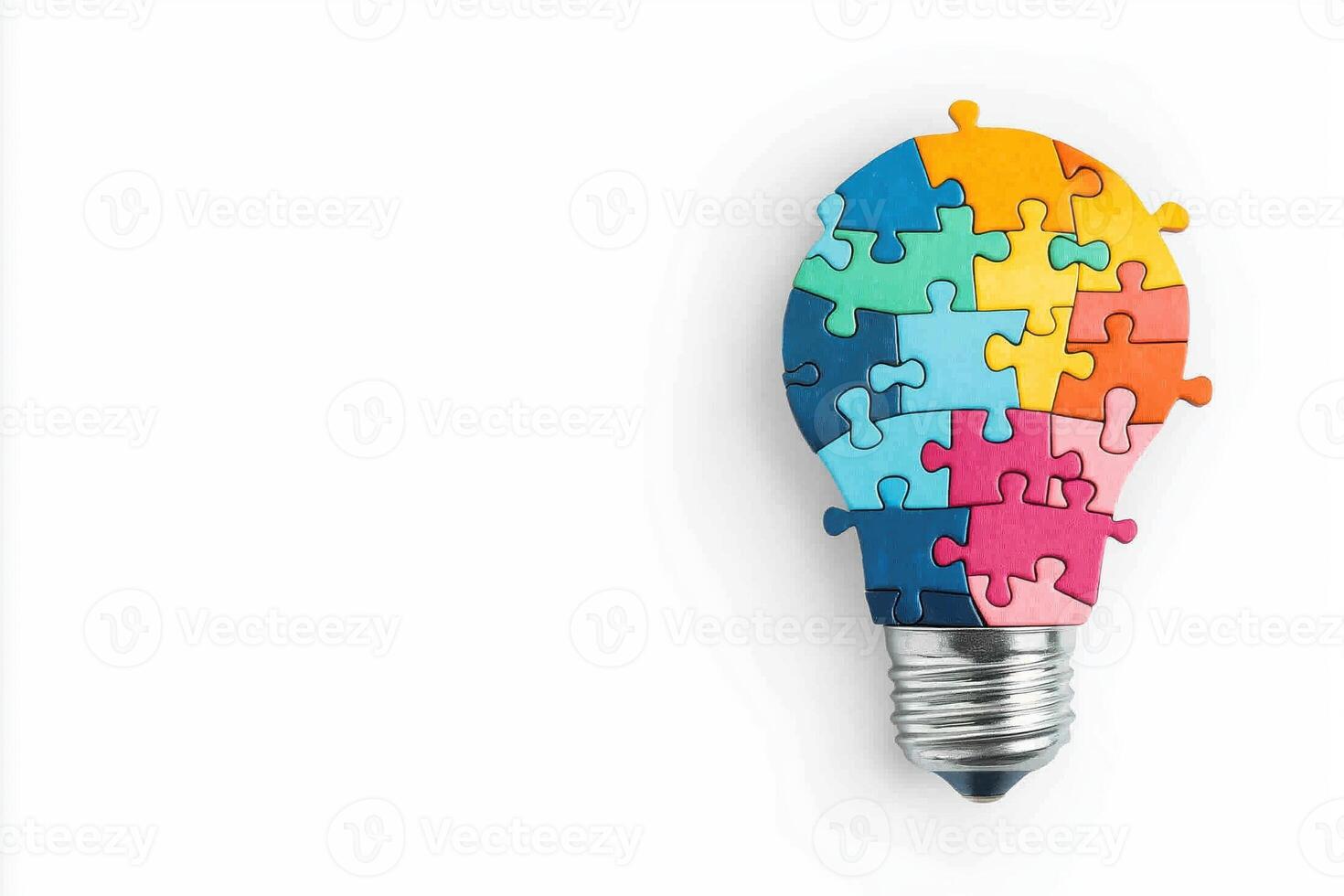 Diverse Teamwork Concept Illustrated by Colorful Jigsaw Puzzle Pieces in a Lightbulb Shape photo