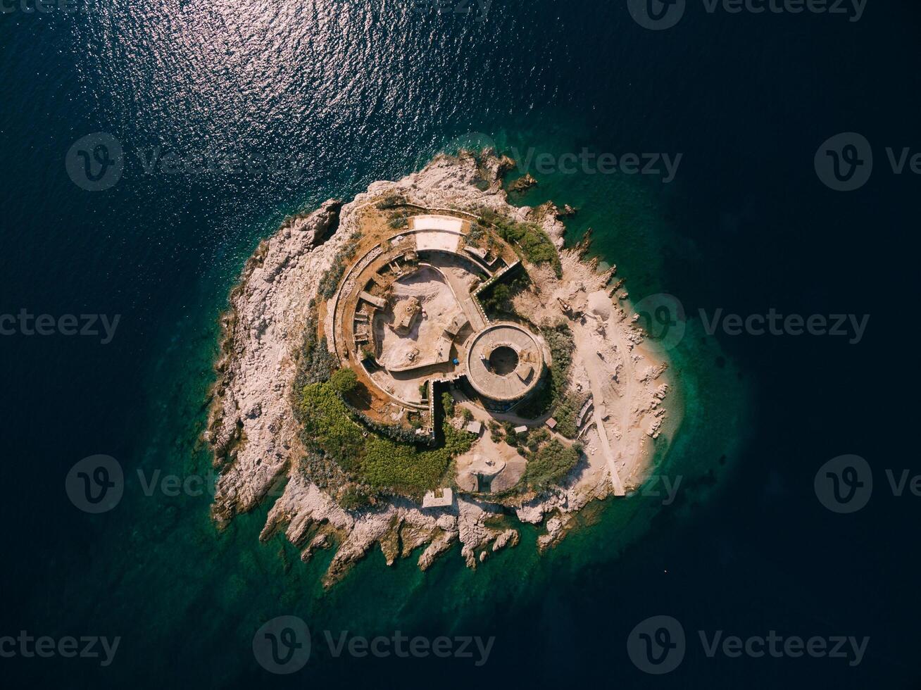 Aerial View of Abandoned Island Structures Surrounded by Water photo