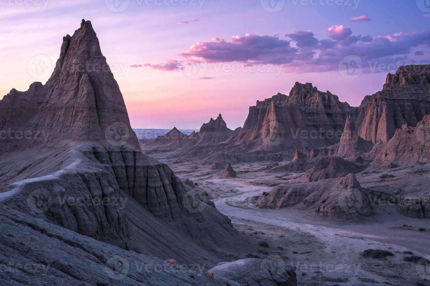 Stunning Badlands Landscape at Sunset with Unique Rock Formations and Expansive Desert Views photo
