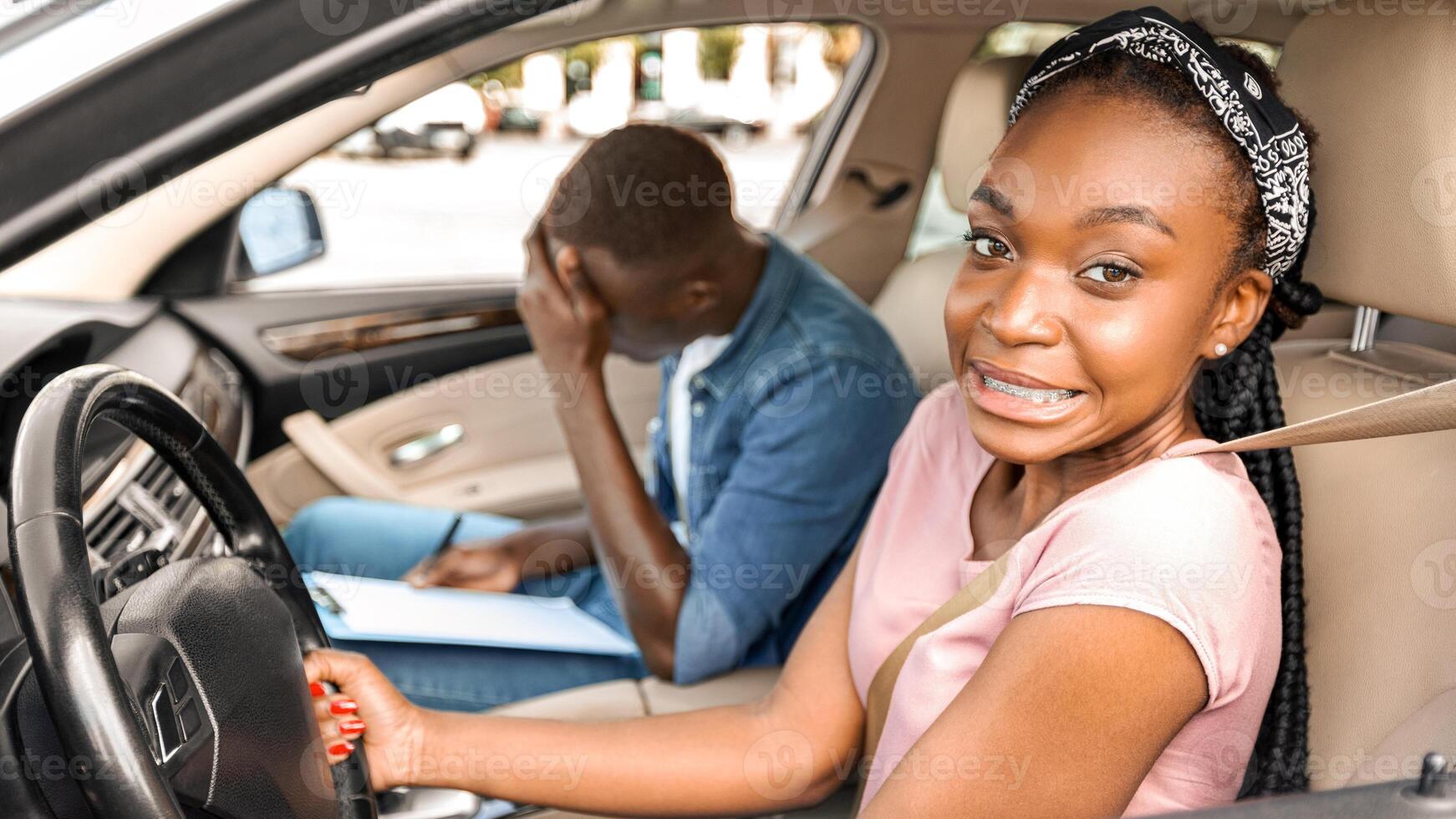 Young black lady driving school student driving car with instructor, making mistakes or failed exam, exhausted coach sitting by with chart and touching his head, side view, copy space photo