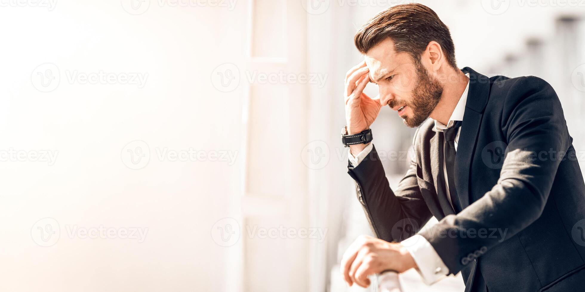 Schedule changes. Stressful businessman waiting at airport after flight delays and cancellations, empty space photo
