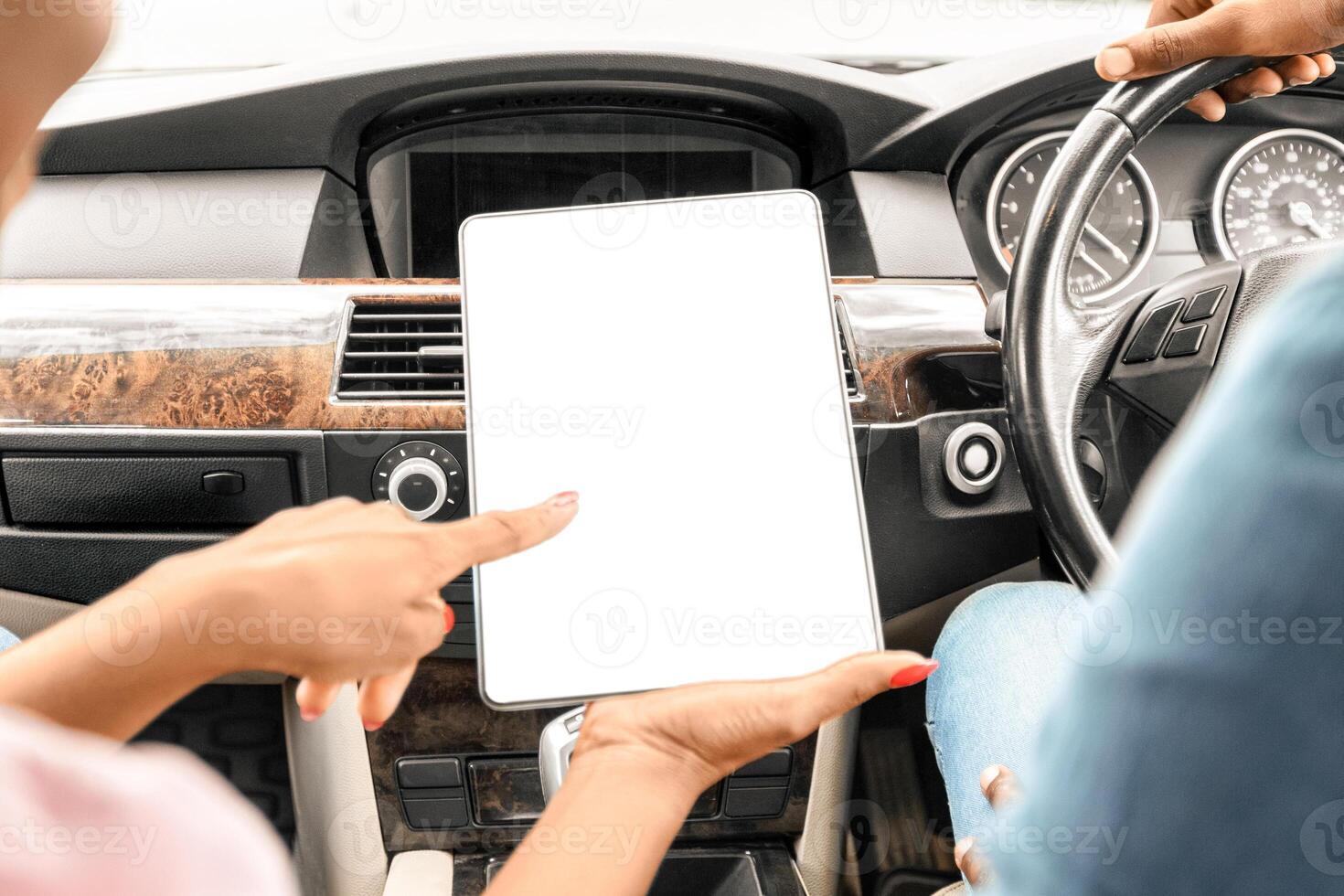 Closeup of digital tablet with blank screen in black lady hands, unrecognizable african american man and woman travelling together by car, using mobile application for gps or tracking on pad, mockup photo