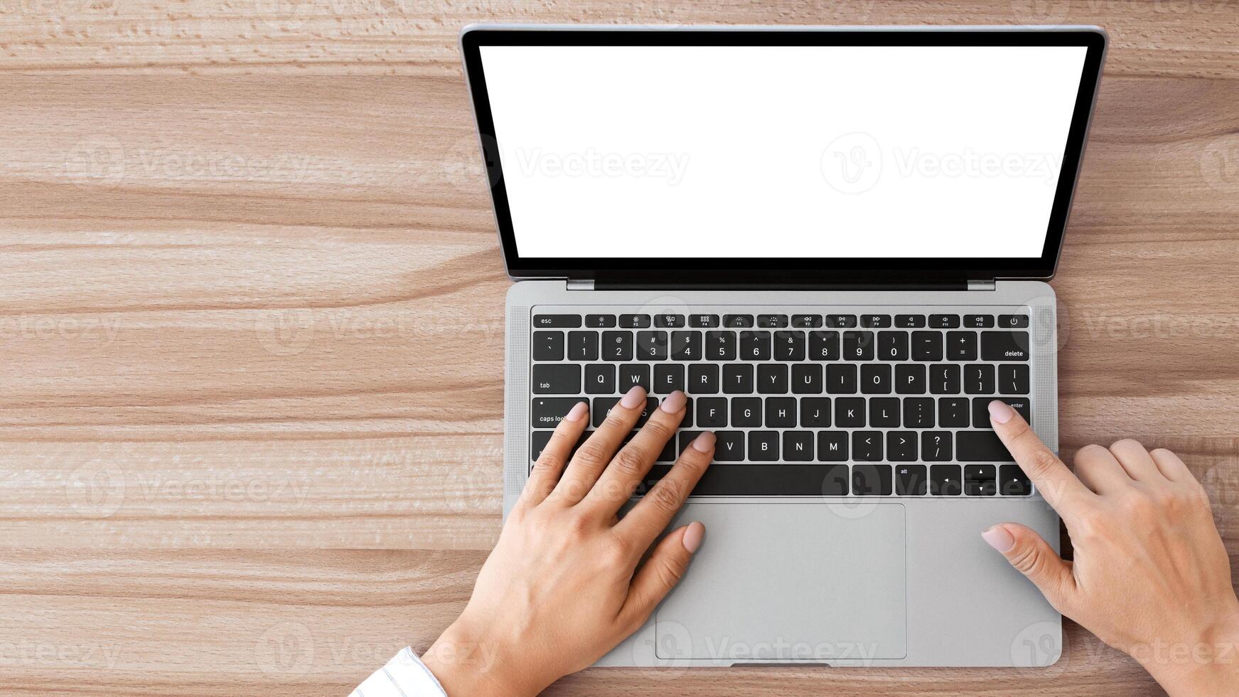 Searching Information. High angle view of manager using computer with blank screen, touching buttons photo