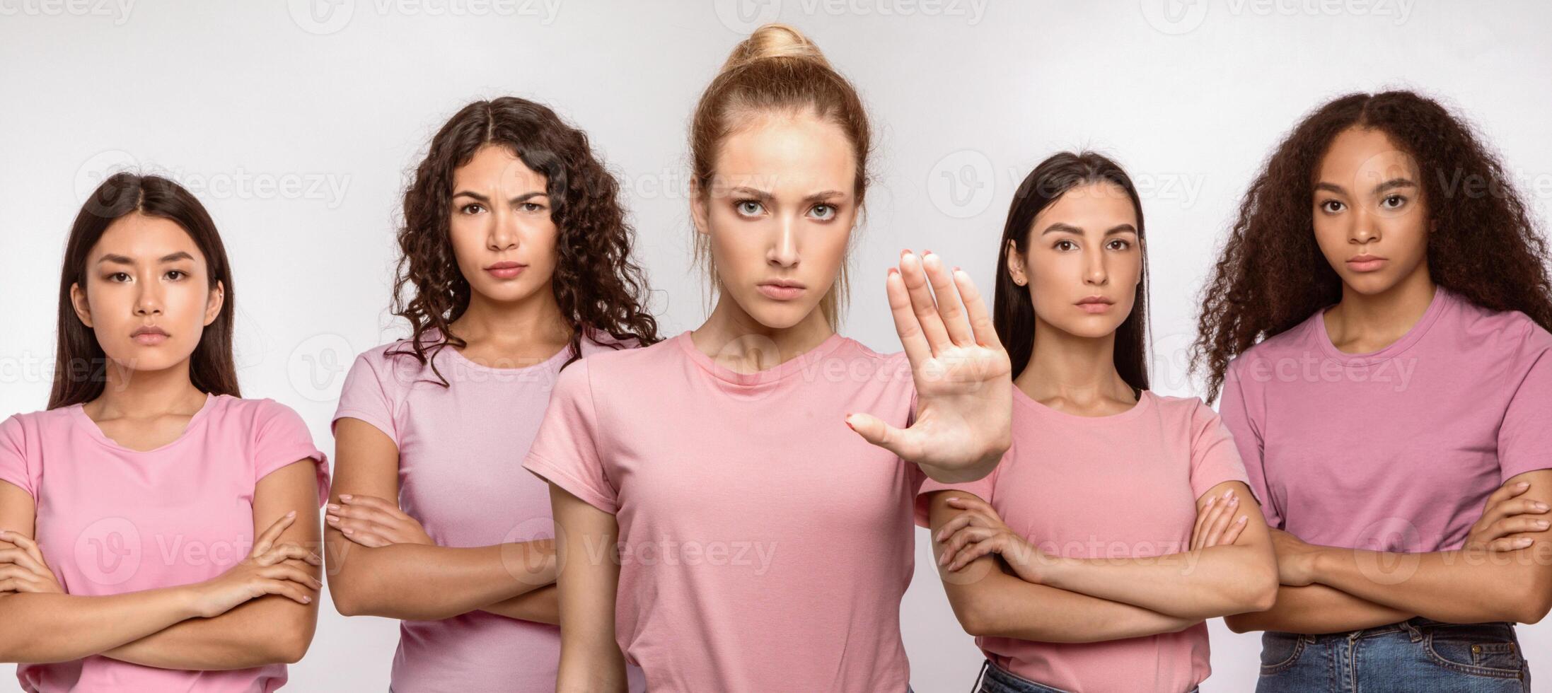 Discontented Multiethnic Ladies Gesturing Stop Standing Together Over White Studio Background. Forbidding Gestures, Female Group Stopping And Disapproving Something. Panorama photo