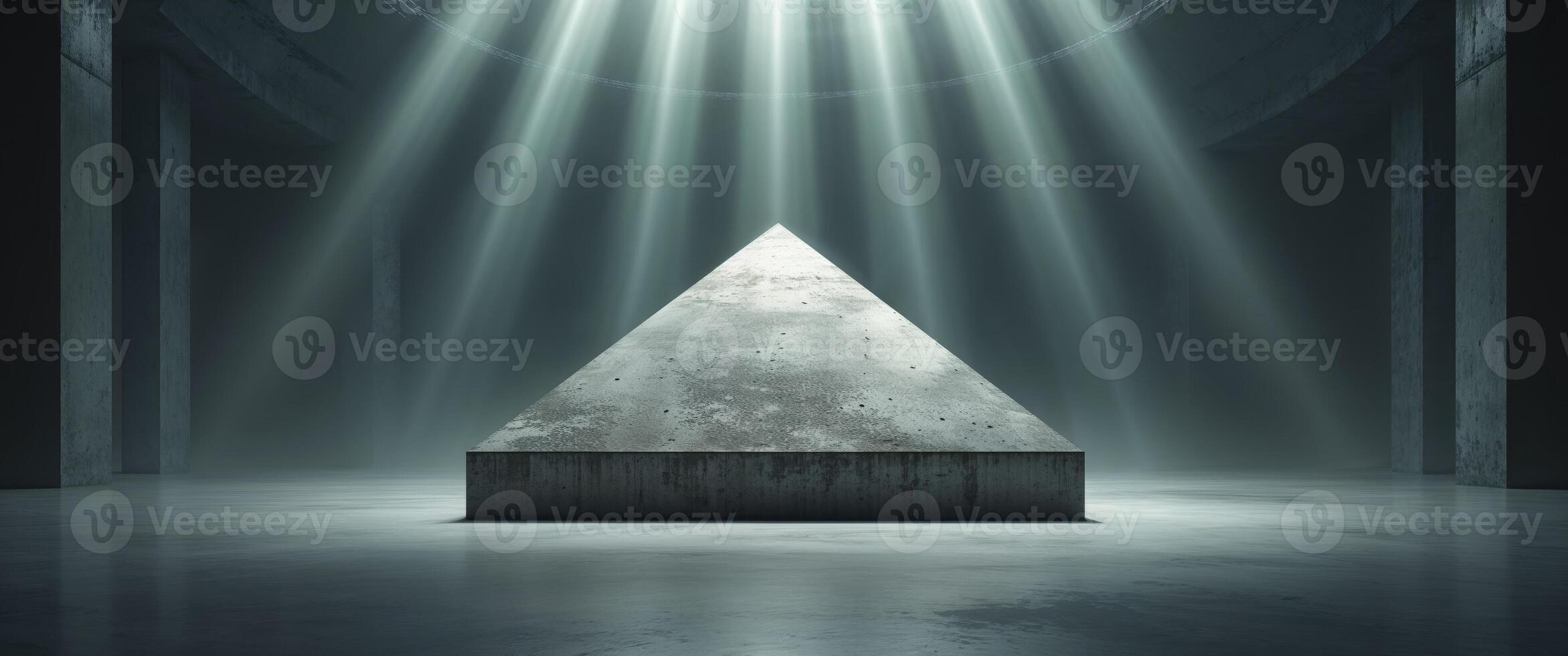A concrete triangle illuminated by celestial light within a room photo