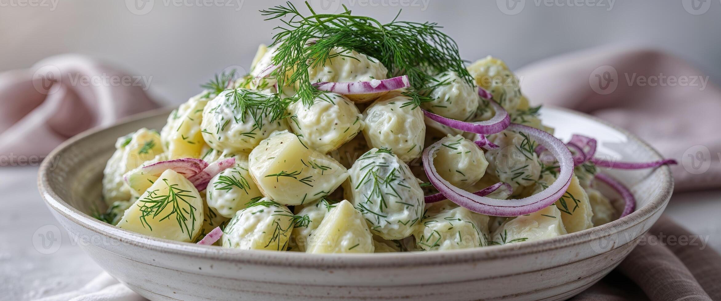 Serving of Potato Salad with Dill and Onion in a Bowl photo