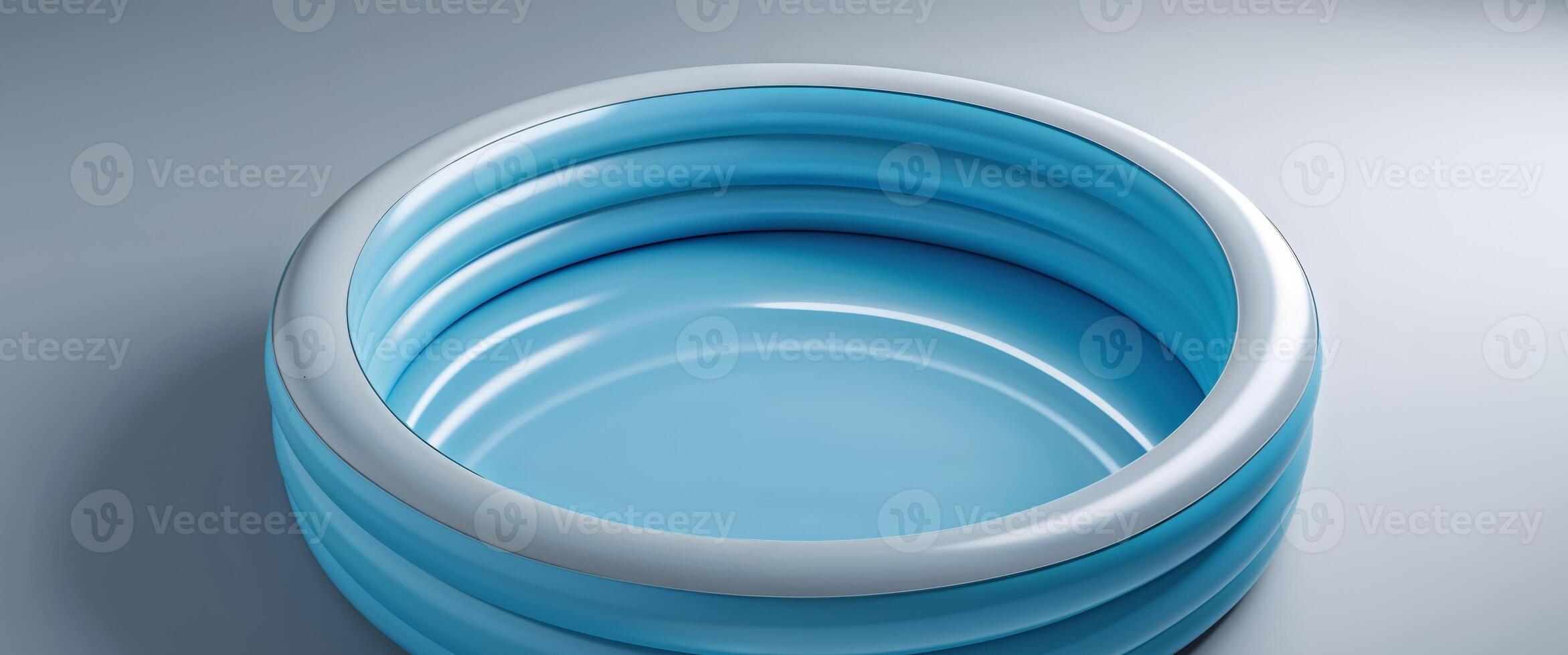 Empty Round Blue Inflatable Pool on Gray Background. photo