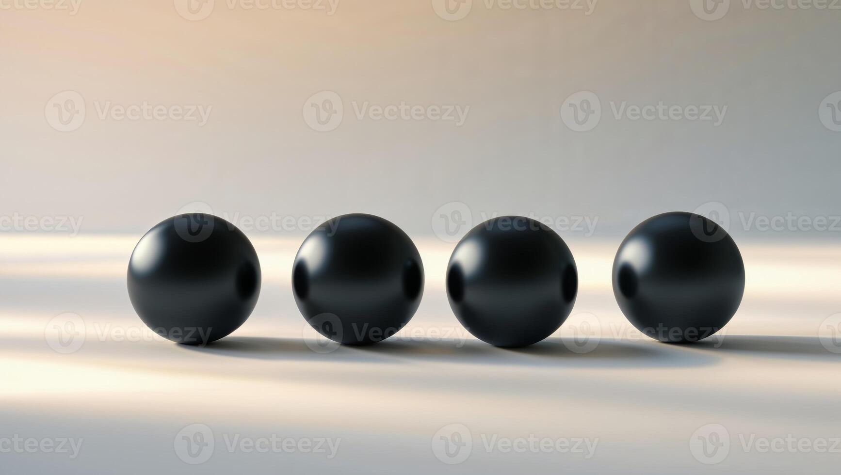 Four black round objects on a white surface photo