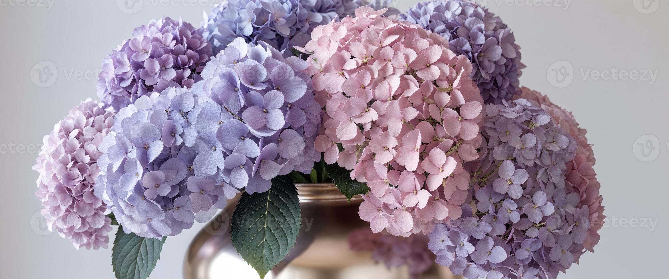 Exquisite floral display of lavender and pink hydrangeas in a chic vase. photo