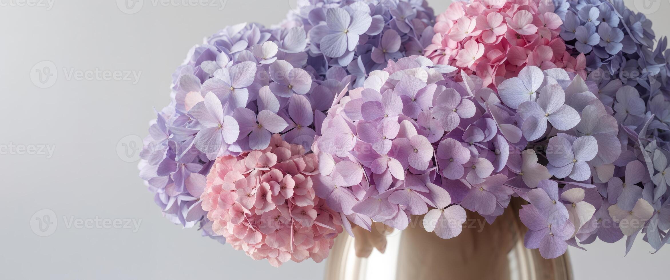 Exquisite floral display of lavender and pink hydrangeas in a chic vase photo