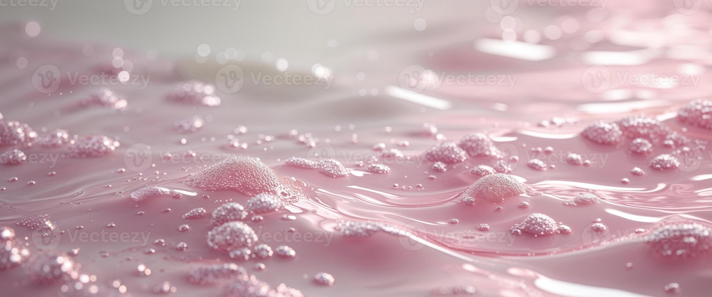 A close up of a pink liquid with bubbles photo